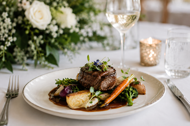 Gourmet plated wedding meal served with vegetables and elegant table décor in Melbourne